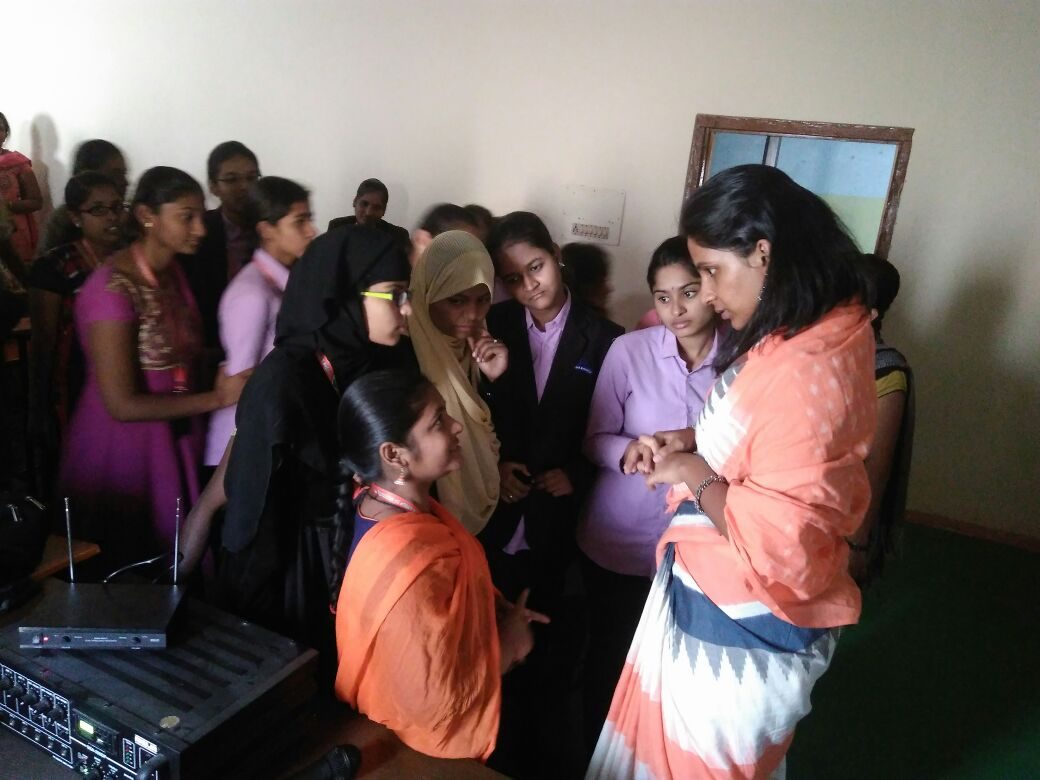 Students gathered around a speaker at the Satya Sai Seva programme